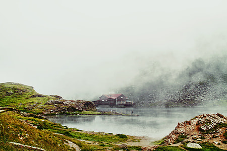 wooden house beside body of water thumbnail