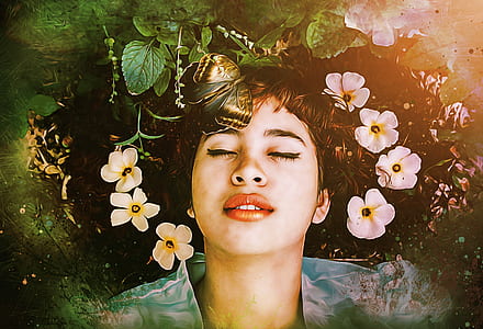 woman lying on body of water with white petaled flowers close-up photography thumbnail