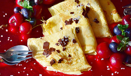 pile crepes with cherries and blue berries thumbnail