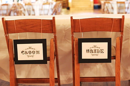 Bride and Groom signboard hanging on chairs thumbnail