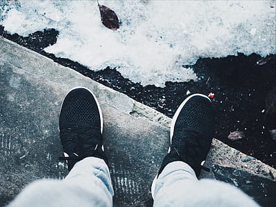 person wearing pair of black shoes thumbnail