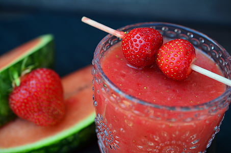 clear glass filled with strawberry juice top with strawberry fruits thumbnail
