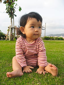 toddler's sitting on grass thumbnail