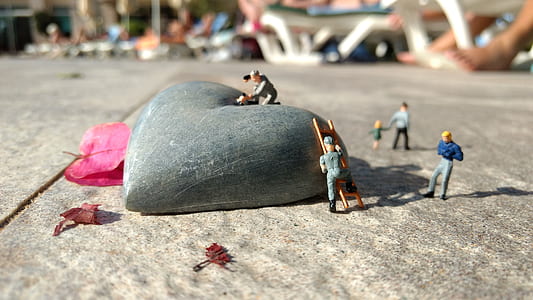 gray heart stone on floor thumbnail