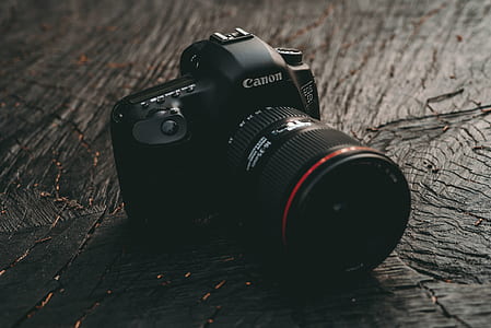 black Canon DSLR camera thumbnail