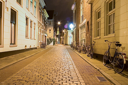 photo of alley near two concrete buildings during nighttime thumbnail