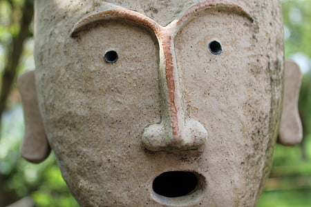 close-up photo of grey statuette thumbnail