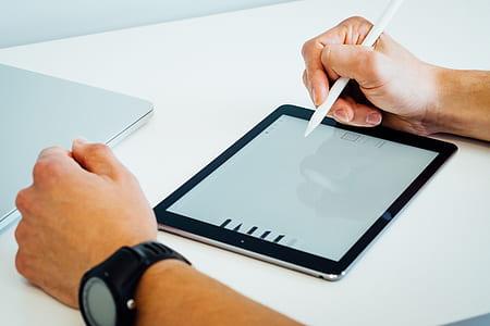 man holding white stylus thumbnail
