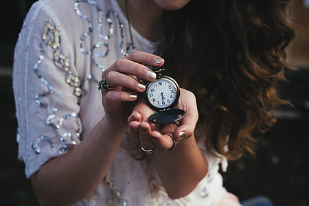 woman holding pocket watch at 5:30 thumbnail