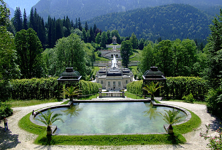 white palace surrounded by green trees at daytime thumbnail