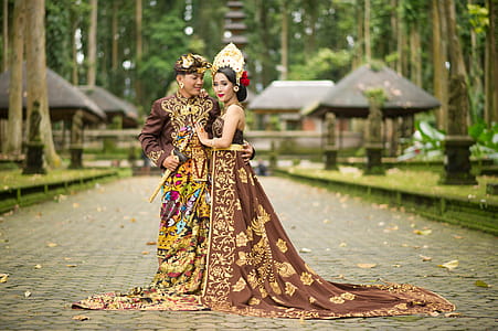 Photo of Man and Woman Wearing Brown Floral Dress thumbnail