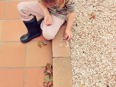 girl wearing gray shirt and black boots thumbnail