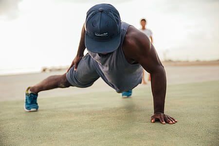 One armed push-up exercise by a young african man outdoors thumbnail