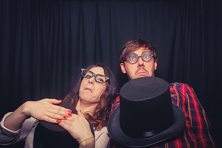 two woman making face near black curtain thumbnail