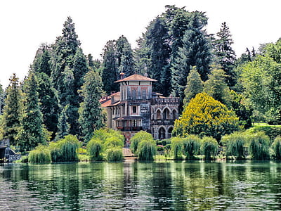 panoramic photo of house near body of water thumbnail