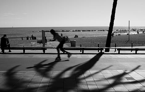 Person Skating on Road in Grayscale Photography thumbnail