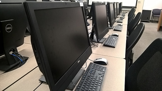 flat screen monitor, keyboard, and mouse on desk thumbnail