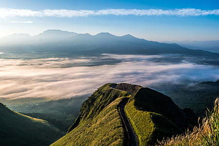 birds eye view photography of mountains near clouds thumbnail