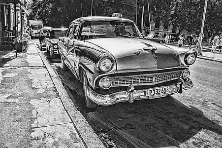 Grayscale Photography of Vintage Car Beside Pavement thumbnail