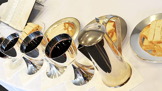 silver steel pitcher on white surface thumbnail