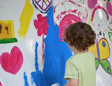 child painting on wall thumbnail