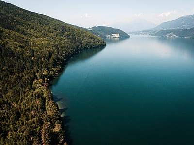 lake under cloudy sky during daytime thumbnail