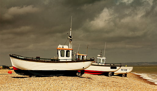 white boats near sea shores thumbnail