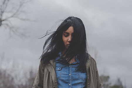 woman looking down while walking thumbnail