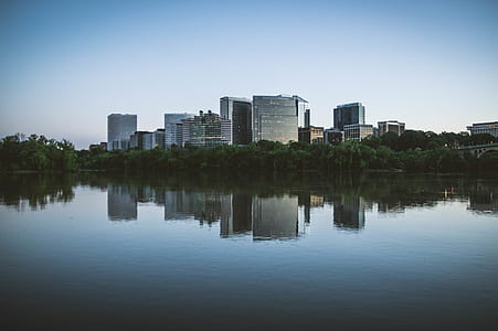photo of calm body of water far away from city thumbnail