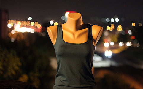 shallow focus photo of female torso mannequin in black tank top thumbnail
