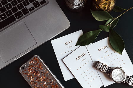Home office desk with Macbook, iPhone, calendar, watch & organizer thumbnail
