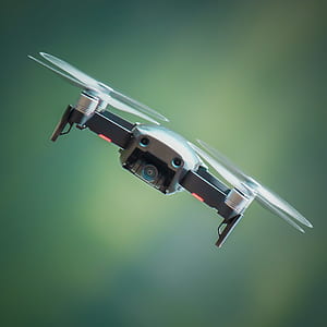 selective focus photography of flying drone at daytime thumbnail