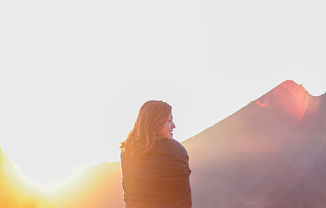smiling woman with mountain background thumbnail