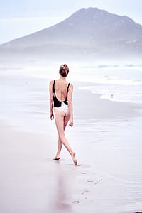 woman wearing black and white one-piece swim suit thumbnail