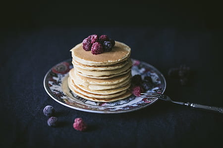 baked pancakes with blueberry and raspberry on white and red ceramic plate thumbnail