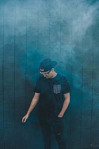 man wearing black flat-brimmed cap and white framed sunglasses thumbnail