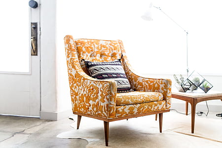white and brown floral sofa armchair and white and brown throw pillow in the room thumbnail