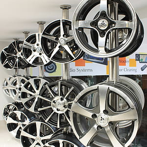 vehicle wheel lot hanged on rod thumbnail