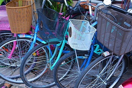 several bicycles with baskets thumbnail