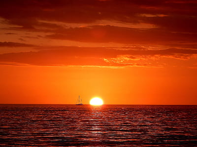 boat at the sea during sunset thumbnail