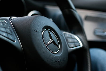 selective focus photography of black Mercedes-Benz car steering wheel thumbnail