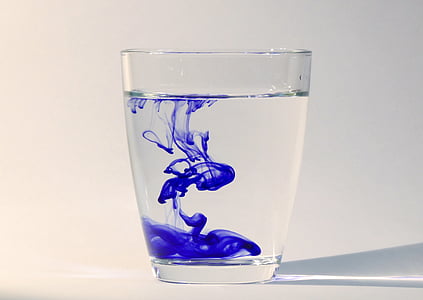clear drinking glass with blue liquid thumbnail
