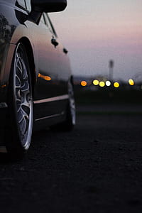 close-up photo of gray multi-spoke vehicle wheel and tire thumbnail