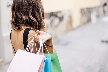 woman carrying paper tote bags thumbnail