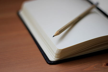 pencil on opened book thumbnail