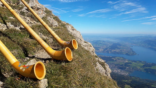 photo of three brown tubes on cliff thumbnail