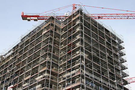 low angle photography of gray high rise building during daytime thumbnail