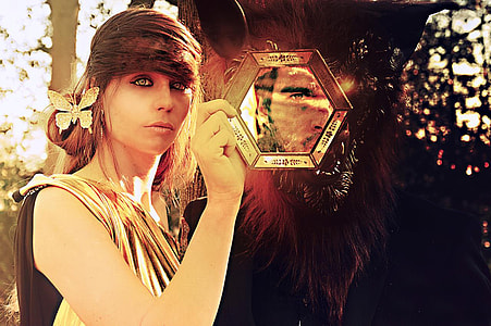 woman holding glass mirror thumbnail