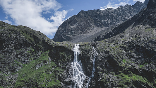 waterfalls on mountain during daytime thumbnail