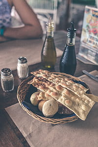 Pastries On Brown Wicker Basket Near Condiments thumbnail